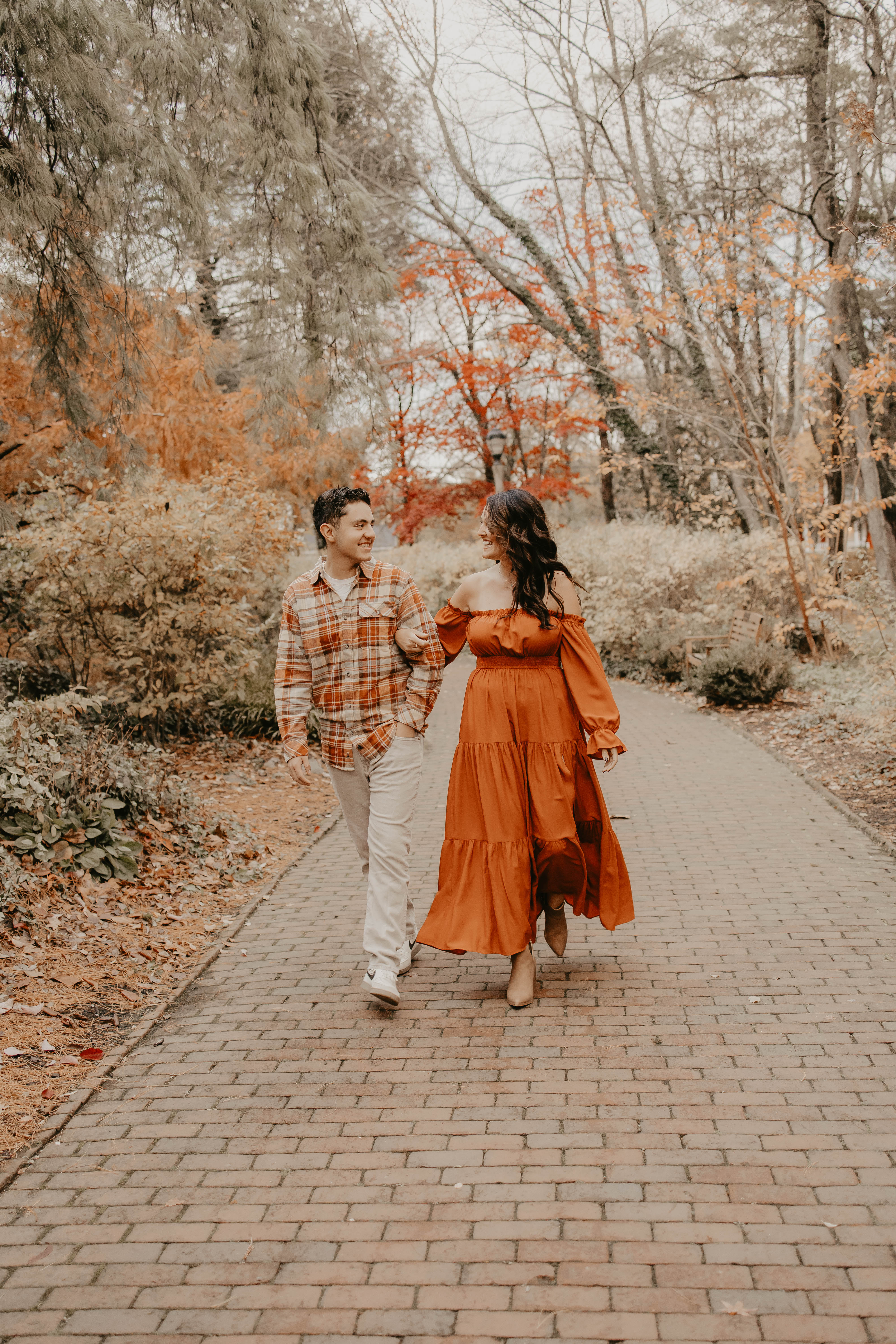 Kristen walking with her teenage son outdoors in the fall.